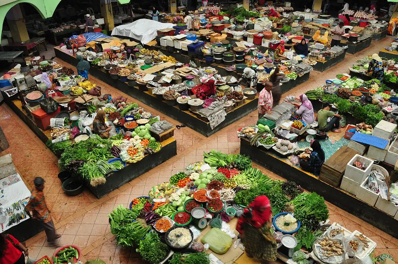 Overhead view of the vibrant Siti Khadijah Market, packed with fresh fruits, vegetables, and local vendors selling goods